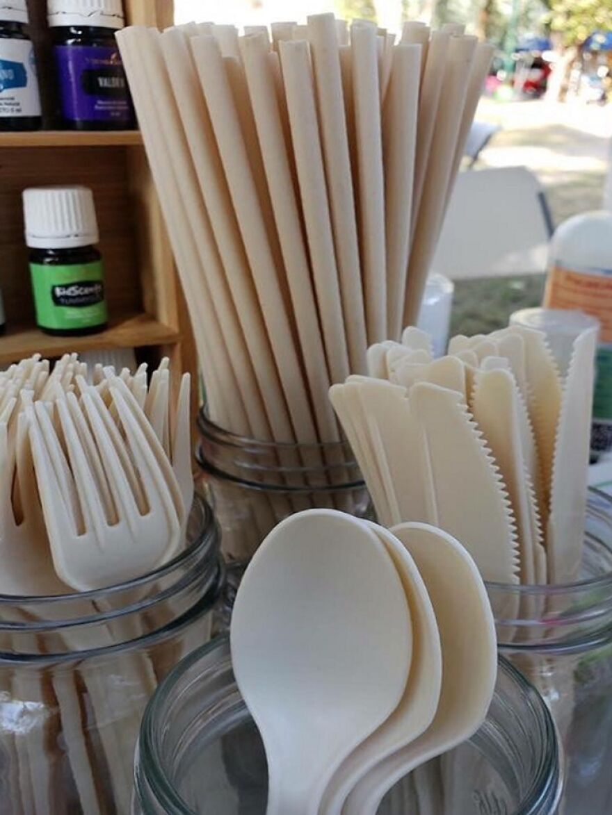 Reusable utensils including forks, spoons, and knives in jars, showcasing eco-friendly designs from an online community post.