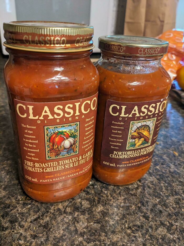 Two jars of Classico pasta sauce on a kitchen counter, illustrating consumerism through packaged food products.