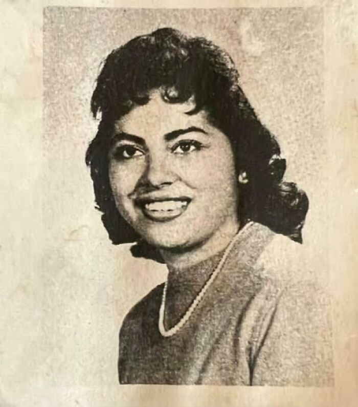 Black and white portrait of a smiling woman illustrating morally grey acts shared in the chaotic good online group.