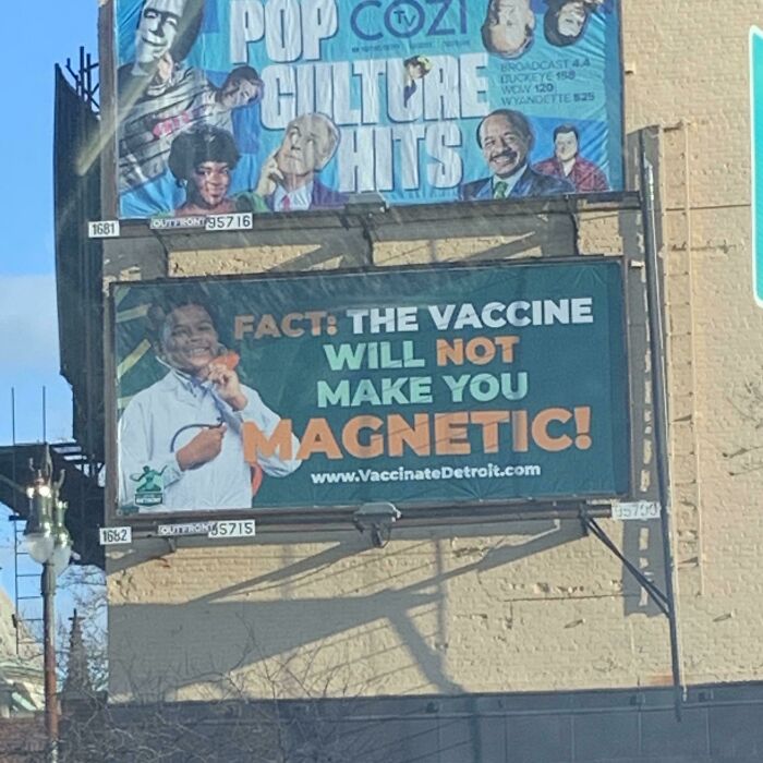 Billboard in an urban setting with a message about vaccine misinformation, relevant to point of no return photos.