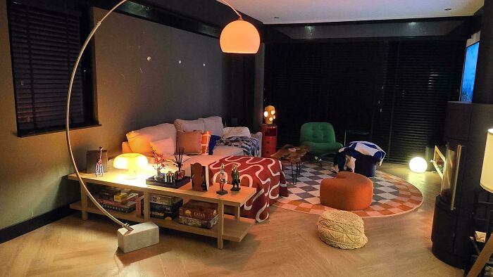 Cozy living room corner with modern decor and warm lighting showcasing home decorating people are proud of.