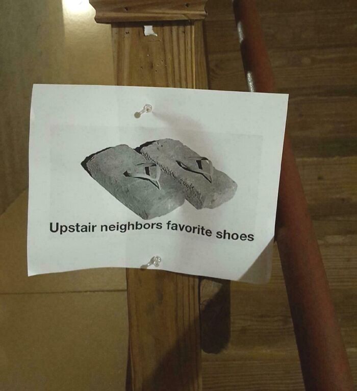 Funny unhinged neighbor note pinned on a staircase railing showing a sarcastic image of heavy shoes.