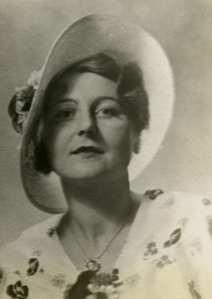 Portrait of a woman scientist wearing a hat and floral dress, featured in Smithsonian remarkable women scientists collection.