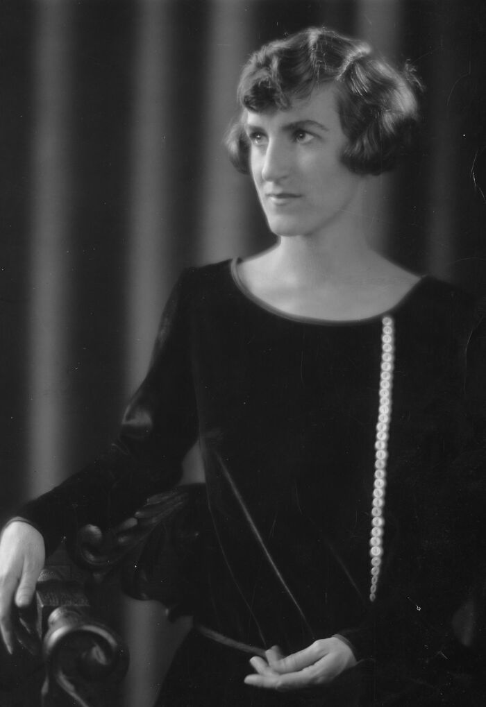 Black and white portrait of a woman scientist from Smithsonian collection wearing a dark dress with a pearl decoration.
