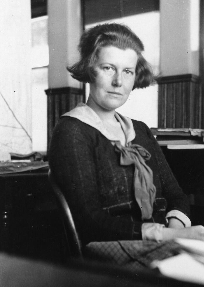 Black and white portrait of a woman scientist seated indoors, representing remarkable women scientists in history.
