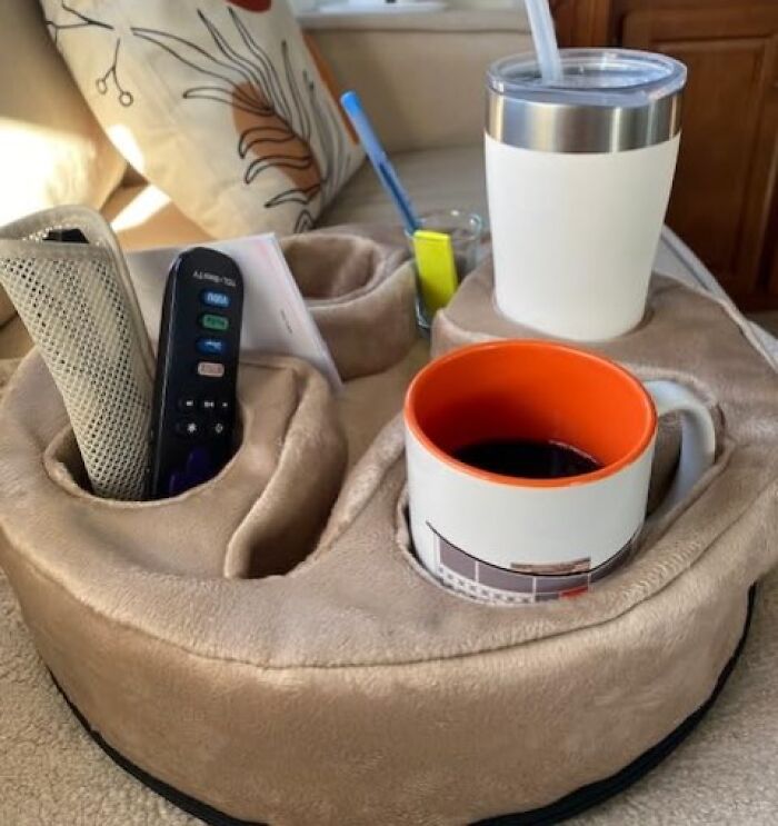 Plush organizer with cup holders and compartments holding mugs, remotes, and stationery, showcasing Amazon finds for home use.