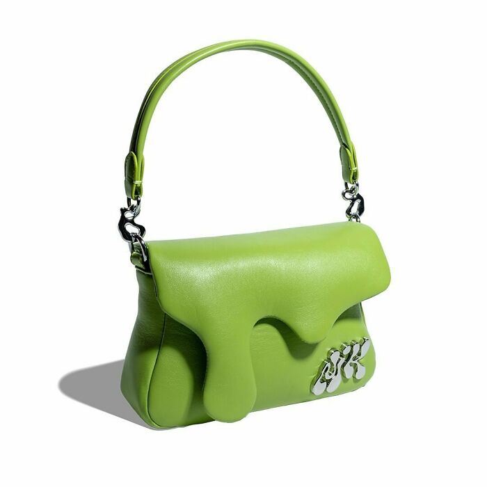 Green leather handbag with a melting design and silver chain details, one of Nik Bentel's unusual fashion accessories.