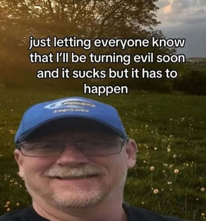 Man wearing blue cap with glasses smiling in field at sunset with meme text about turning evil, fitting broken sense of humor memes.