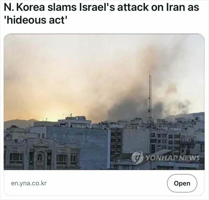 City skyline with smoke rising at sunset, illustrating a true headline from satire-worthy news headlines.