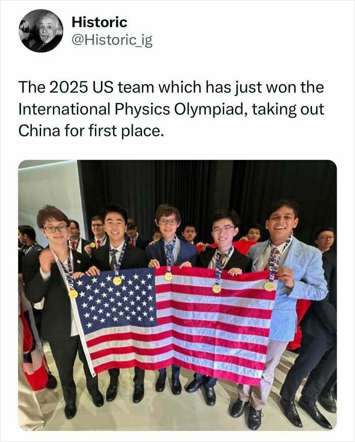 US International Physics Olympiad team celebrating victory with medals and American flag, a historic moment in competition history.
