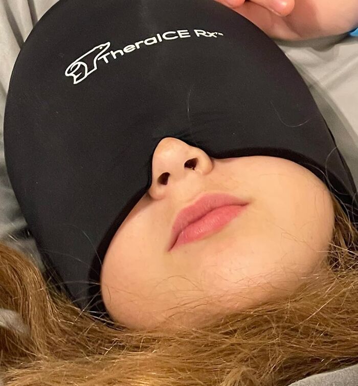 Person wearing a black TheraICE Rx cooling eye mask as a heatwave hack to stay cool and comfortable during summer.