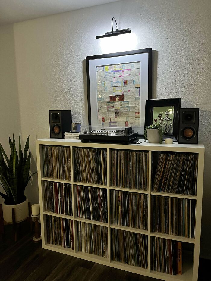 Vinyl record collection and turntable setup in a cozy room evoking nostalgic posts from the simpler 90s days.