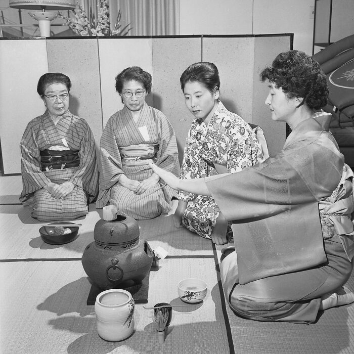 LA women participating in a traditional tea ceremony, dressed in kimonos, embracing cultural heritage and living their best lives in 1962.