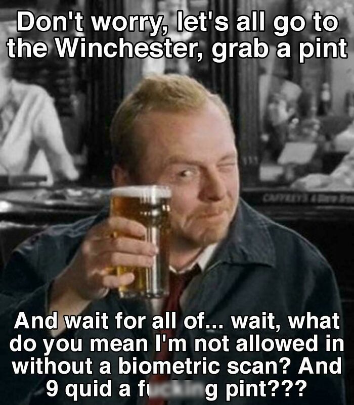 Man in a pub holding a pint, winking, with text referencing chaotic British memes and UK humor.