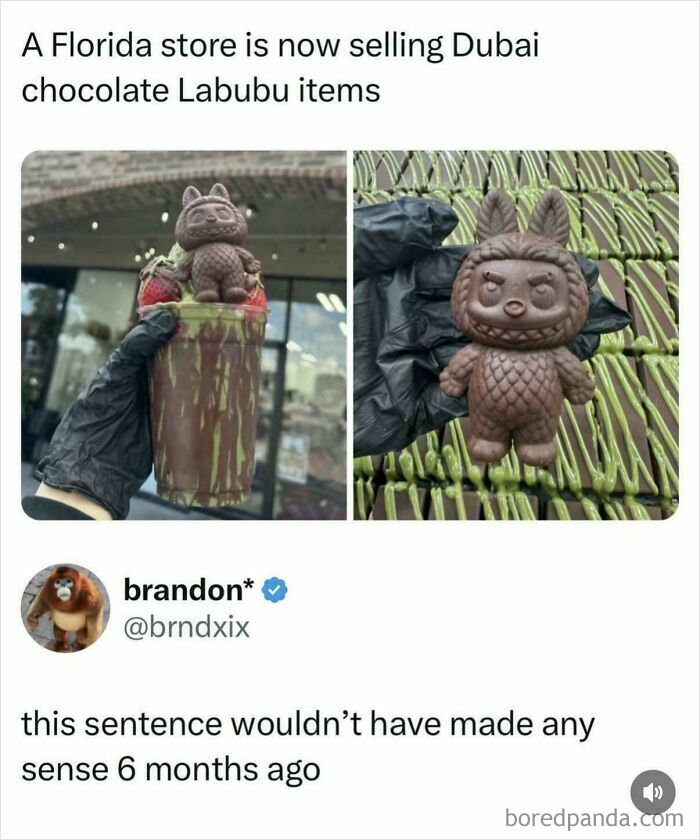 Chocolate Labubu figure on top of a drink held by a gloved hand, highlighting consumerism trends and product novelty.