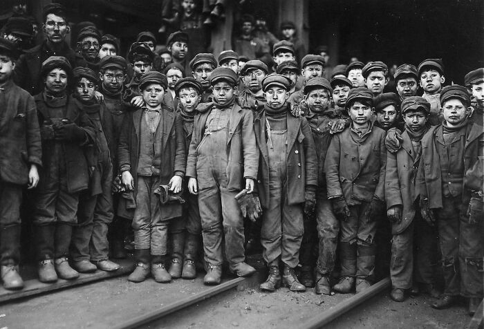 Group of child laborers in early 20th century, highlighting the tragedy and social issues of the era.