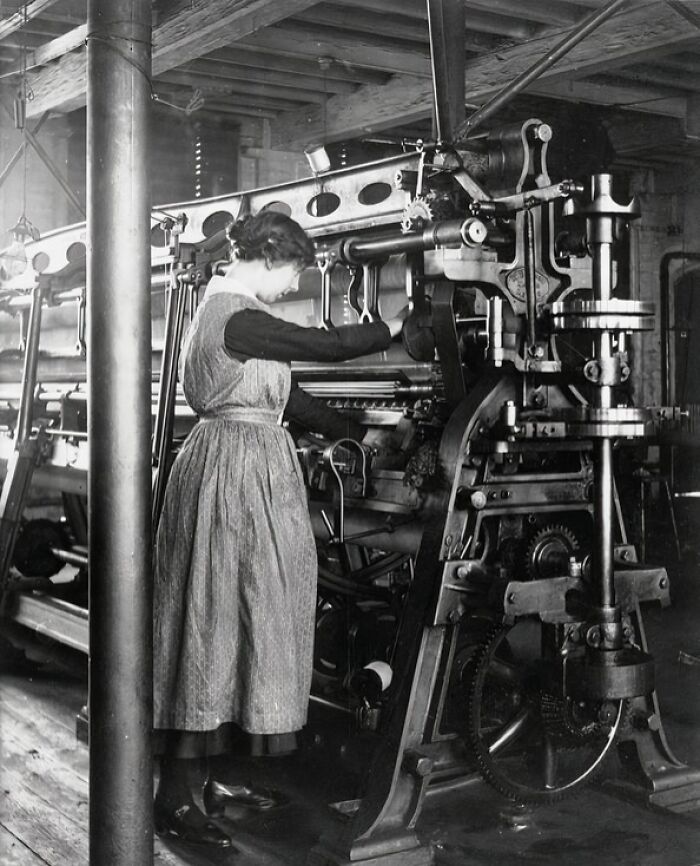 Woman operating industrial machinery during WWI, highlighting women's roles that changed everything in the workforce.