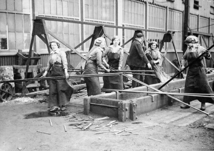 Women working in a factory during WWI, showcasing how women changed everything in wartime industry efforts.