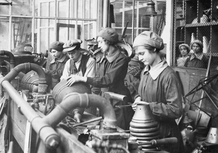Women working in an industrial factory during WWI, showcasing their role in changing everything during the war.