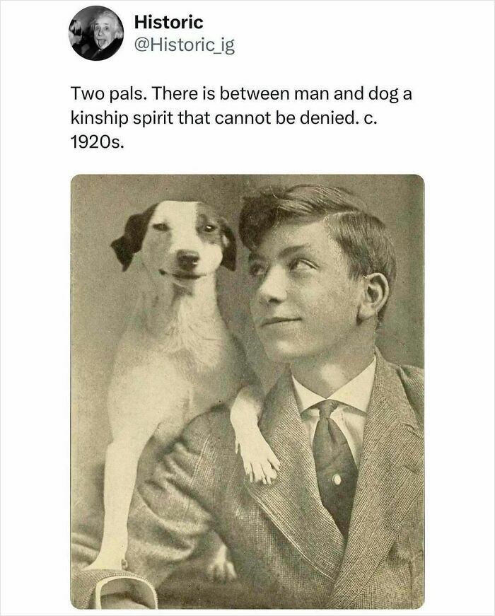 Vintage photo of a young man and his dog showing kinship spirit, capturing an interesting historic moment from the 1920s.