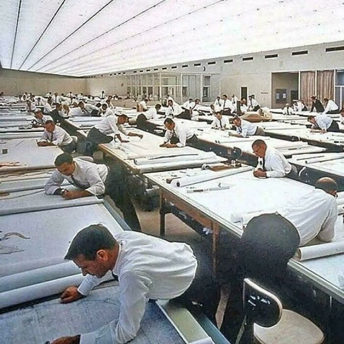Amazing photos: vintage drafting room with dozens of men at long drawing tables working on blueprints