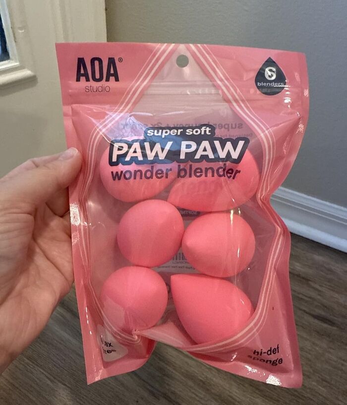 Hand holding a package of pink super soft Paw Paw wonder blender sponges trending on Amazon this week.