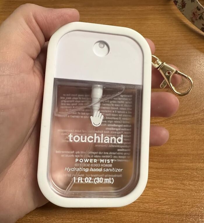 Handheld Touchland Power Mist hydrating hand sanitizer with keychain, trending Amazon add to cart worthy find.