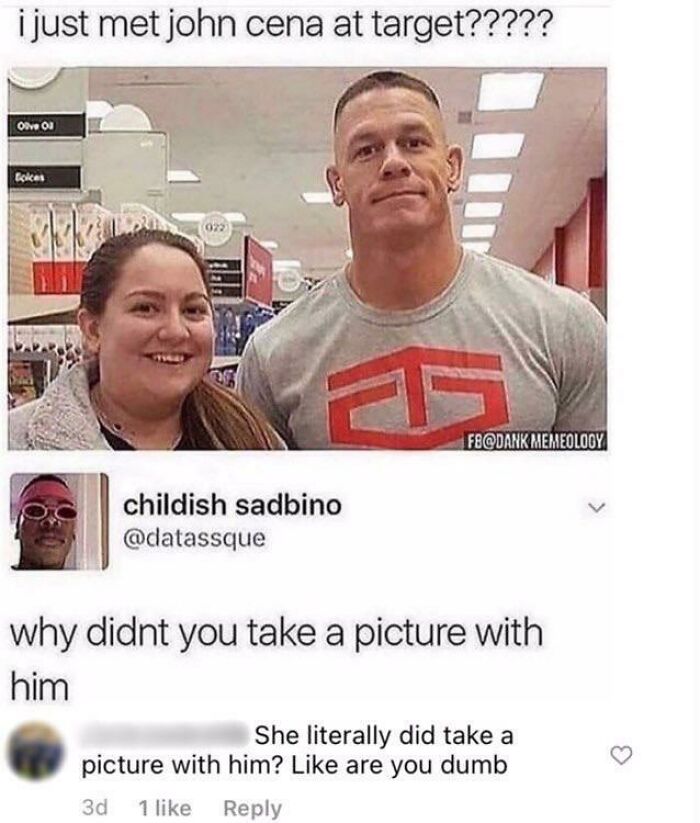 Woman posing with John Cena at a store, highlighting a funny moment where someone missed the joke embarrassingly.