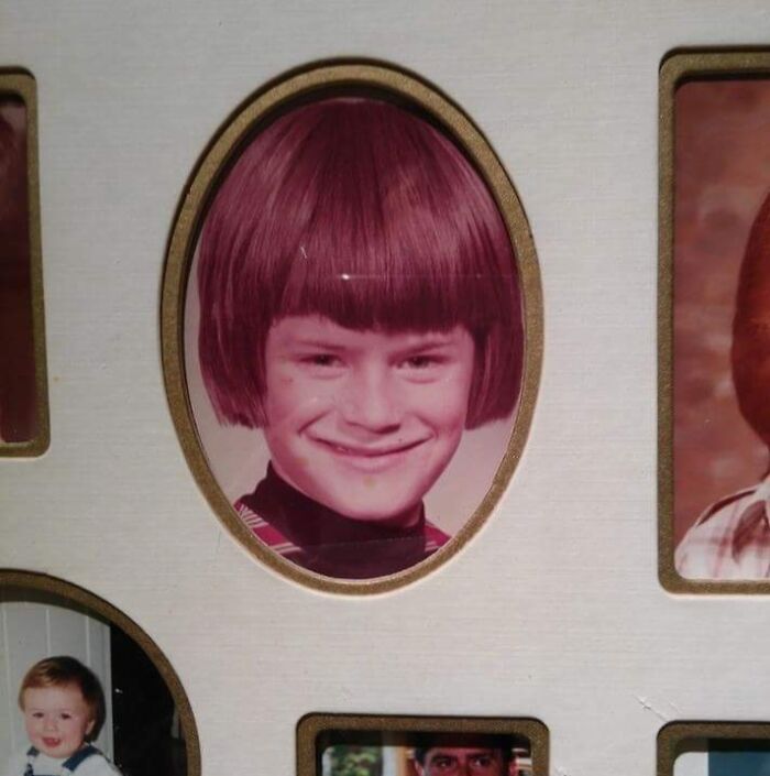 Vintage school photo of a boy with a rare coincidence hairstyle that looks almost photoshopped but isn’t real.