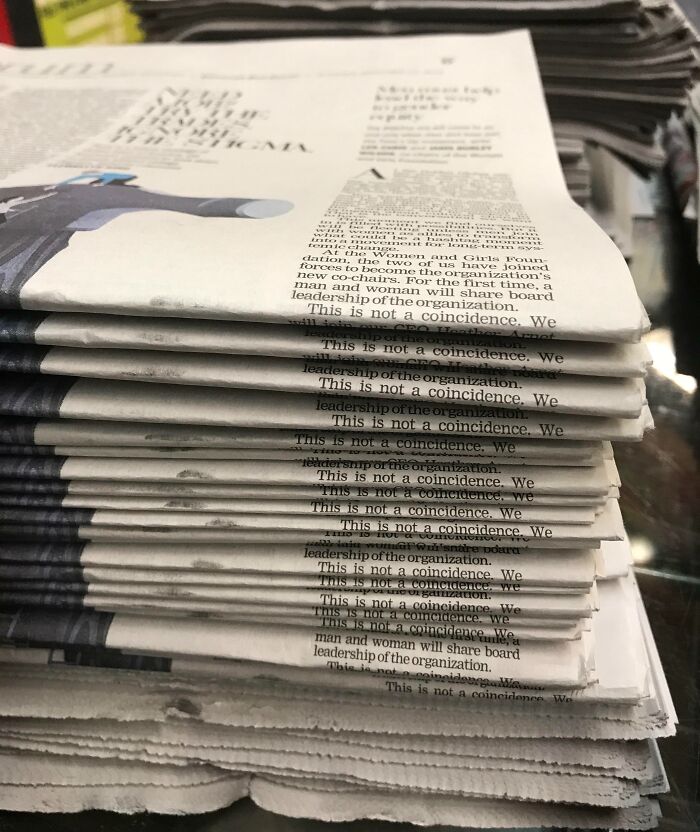 Stack of newspapers with repeated phrase demonstrating rare coincidences appearing naturally in print pages