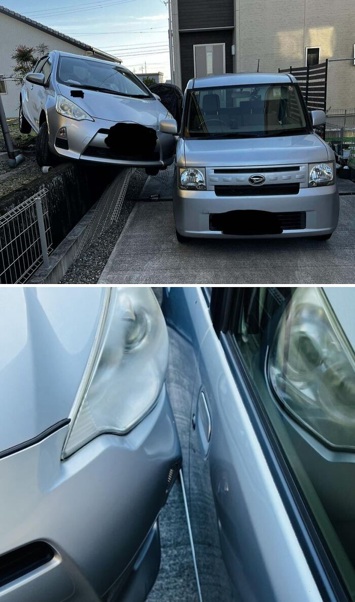 Silver cars in a rare coincidence with one car suspended over a fence and another parked closely beside it.