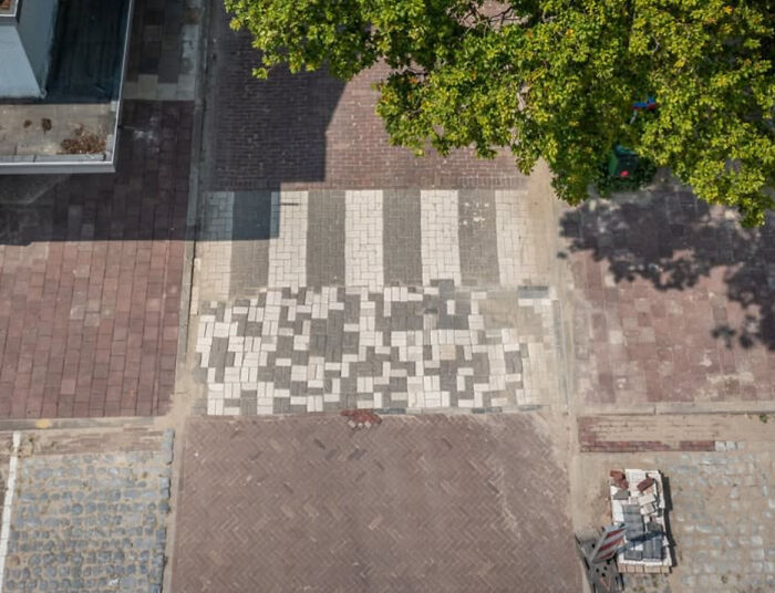 A poorly finished paved sidewalk with mismatched tiles illustrating funny ways people learned their lesson.