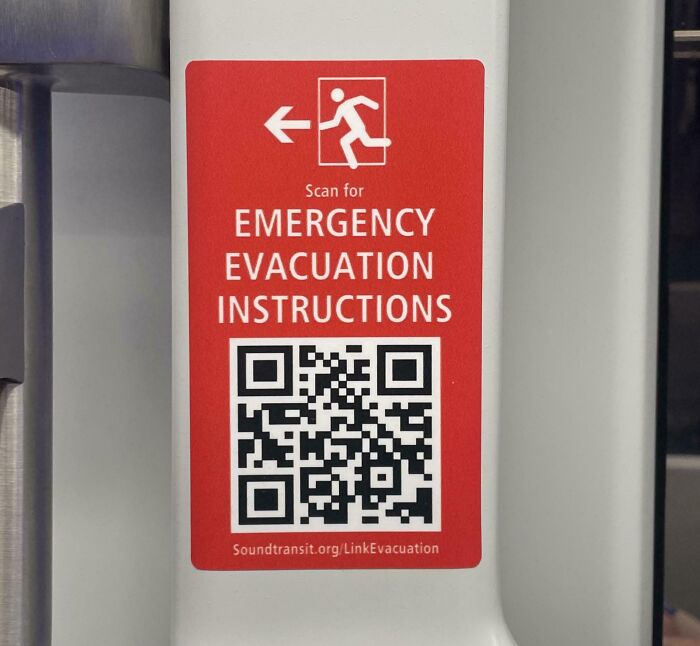 QR code for emergency evacuation instructions on a red sign, relevant to point of no return scenarios and safety measures.