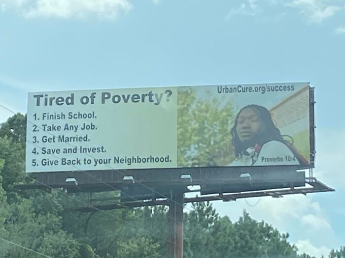 Billboard addressing poverty with steps to success, featured in photos that make you wonder if we’ve crossed the point of no return.