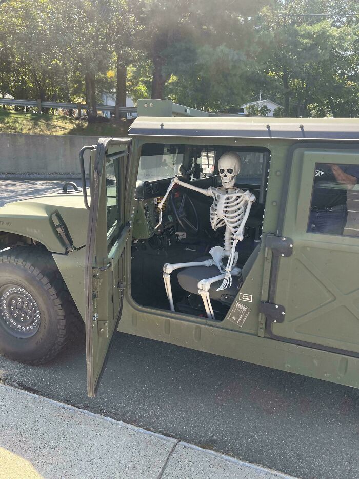 Skeleton sitting in the driver seat of a military vehicle with the door open, illustrating funny ways people learned their lesson.