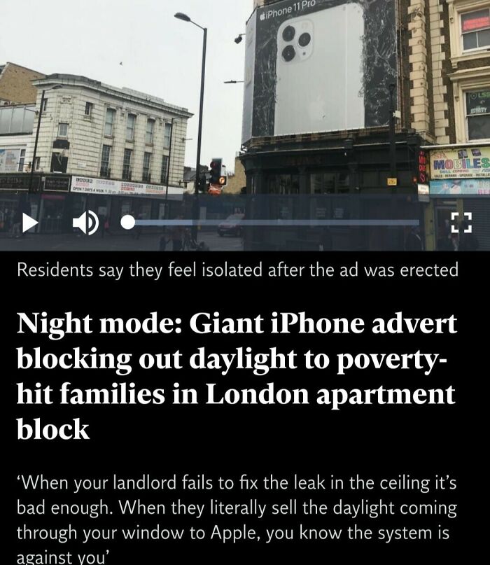 Giant iPhone advert blocking daylight to poverty-hit families in London apartment block, raising questions about point of no return.