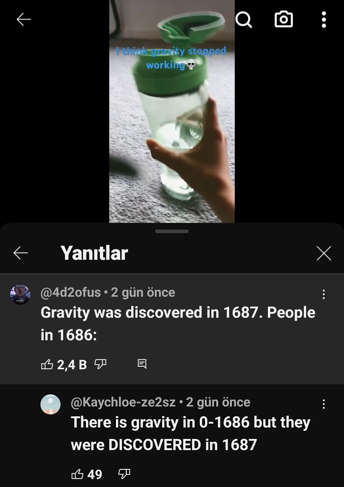 Hand holding a tipped water bottle on carpet, with humor about gravity missed and comments showing embarrassing joke misunderstandings.