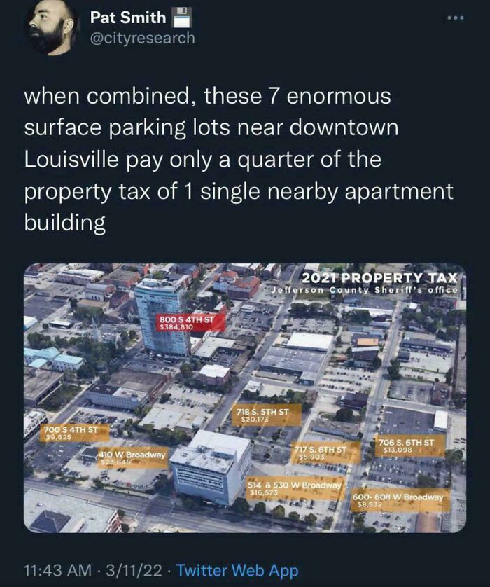 Twitter post highlighting low property taxes on large surface parking lots compared to an apartment building, illustrating affordable housing issues.