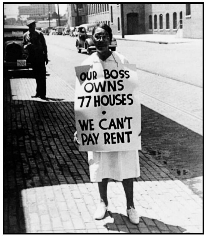 Woman holding a sign protesting rent affordability and housing inequality highlighting lack of affordable housing in the US.