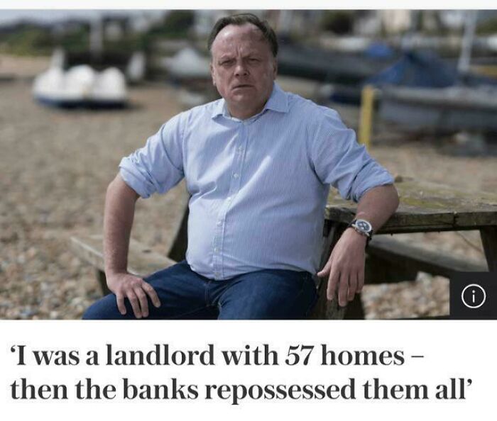Middle-aged man sitting outdoors by the water, representing criticism of the lack of affordable housing in the US.