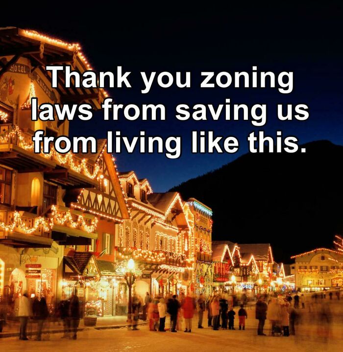 Street scene at night with holiday lights and a text criticizing zoning laws and the lack of affordable housing in the US.