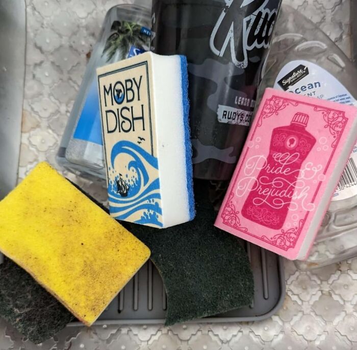 Sponges and dish soap arranged in a dorm kitchen sink, essentials for dorm kitchen survival and cleaning tasks.
