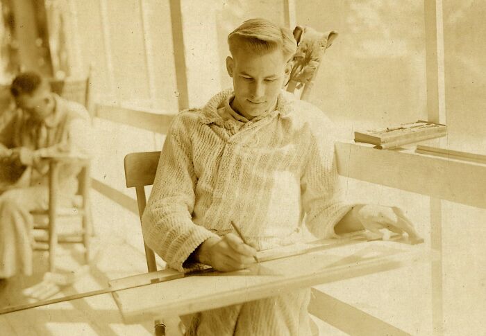 Young soldier sketching a bird, showing daily life beyond the WWI trenches in a calm indoor setting.