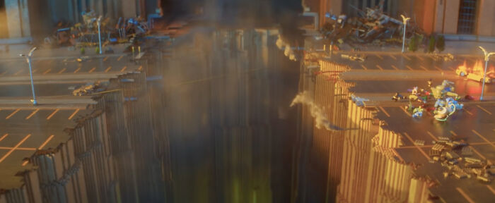 Animated city scene showing a giant gap in the middle of the road with scattered vehicles and smoke rising, depicting a bad movie detail.