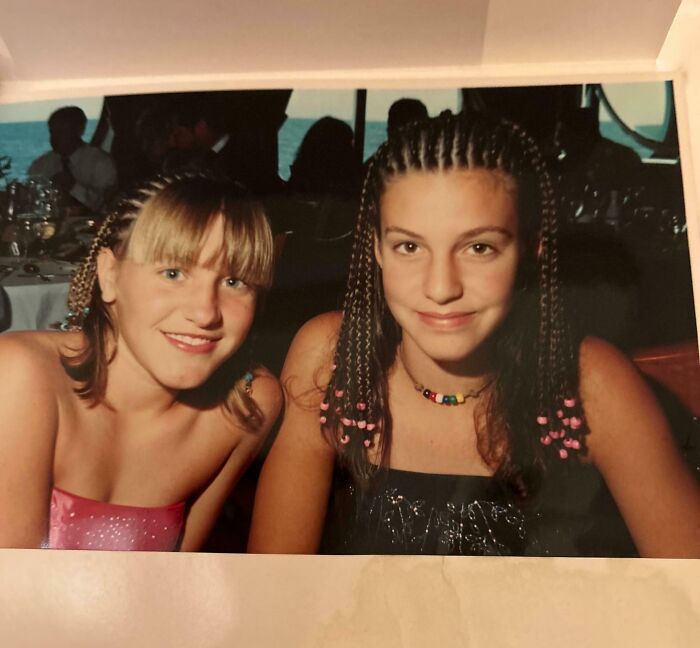 Two young girls smiling at a formal event, capturing a funny ways people learned their lesson moment.