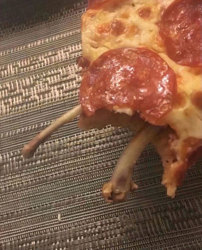 Pepperoni pizza slice with discarded chicken bones, illustrating unhealthy food choices affecting physical and mental health.