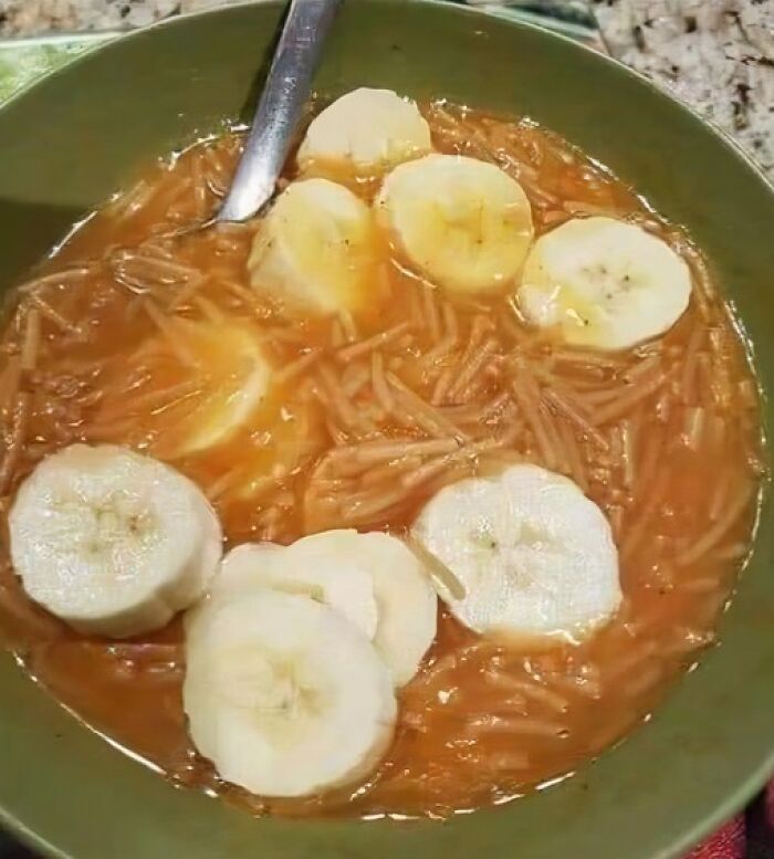 Bowl of food with sliced bananas and noodles, representing unhealthy food to avoid for physical and mental health.