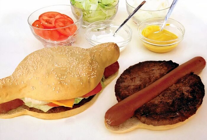 Unhealthy fast food items including a hot dog and burger with condiments highlighting food to avoid for physical and mental health.