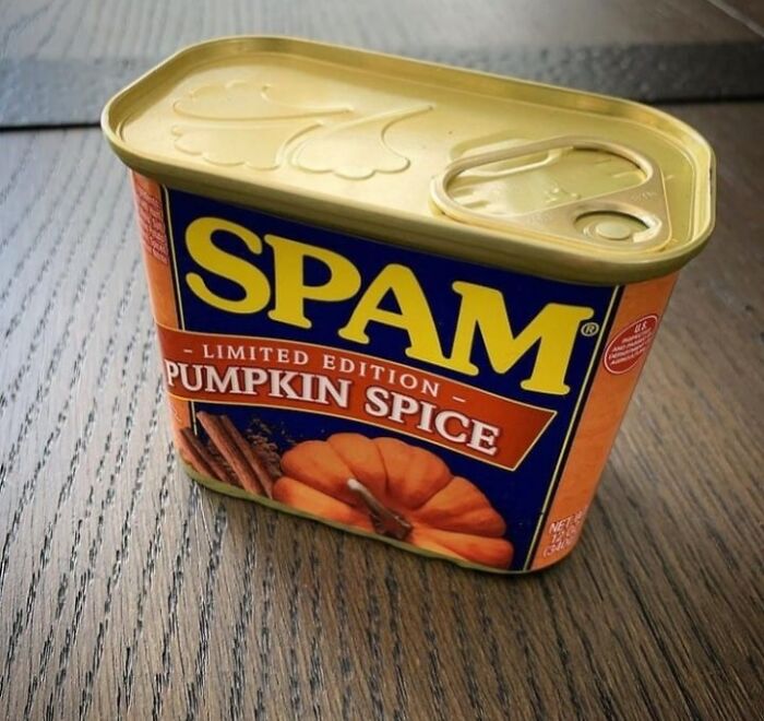 Limited edition pumpkin spice canned food on a wooden table, highlighting unhealthy food choices for physical and mental health.
