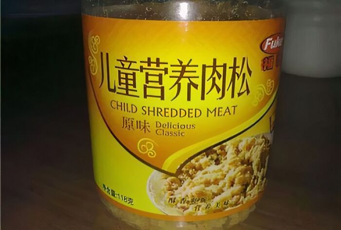 Jar of shredded meat labeled child shredded meat, an example of food nobody should eat for physical and mental health.